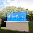Image of The Bank of Elk River sign in front of trees.