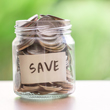 Image of jar full of quarters with the word "Save" on it.