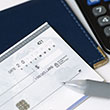 Stock image of a check waiting to be filled out.
